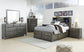 Caitbrook Storage Bed With 8 Storage Drawers With Mirrored Dresser - Premier Furniture & Mattress