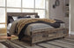 Derekson King Panel Bed with Mirrored Dresser - Premier Furniture & Mattress