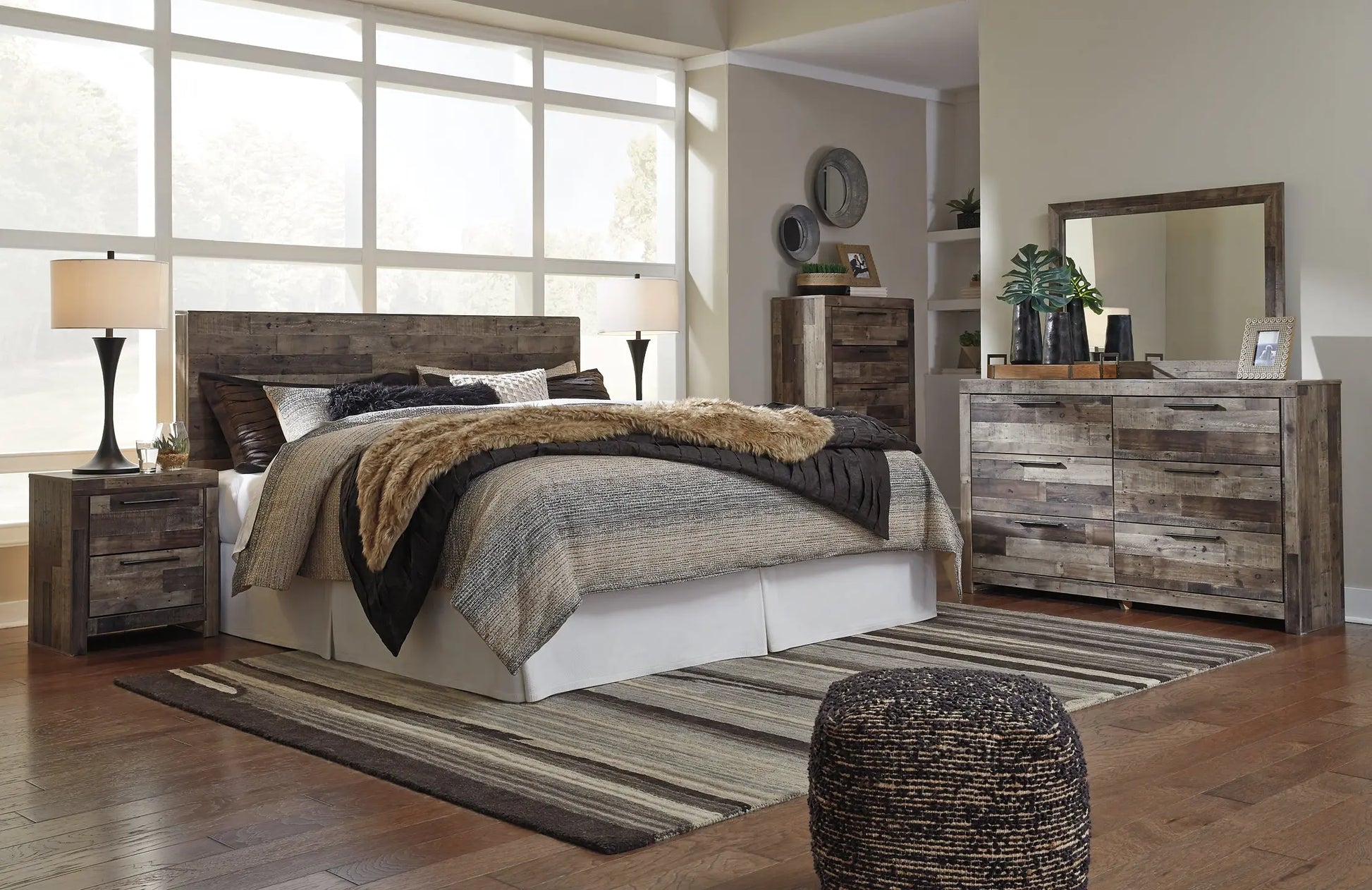 Derekson King Panel Headboard with Mirrored Dresser, Chest and Nightstand - Premier Furniture & Mattress
