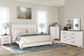 Gerridan King Panel Bed with Mirrored Dresser and Chest Premier Furniture & Mattress