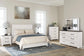 Gerridan Queen Panel Bed with Mirrored Dresser and Chest Premier Furniture & Mattress