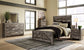 Wynnlow Queen Crossbuck Panel Bed with Mirrored Dresser and Chest Premier Furniture & Mattress