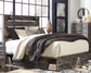 Drystan Queen Panel Bed with 2 Storage Drawers with Mirrored Dresser, Chest and Nightstand - Premier Furniture & Mattress