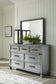 Russelyn King Storage Bed with Mirrored Dresser and Chest - Premier Furniture & Mattress